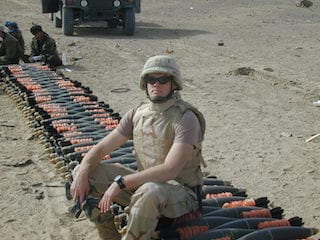 An awesome picture of me sitting on some mortars as an EOD tech.